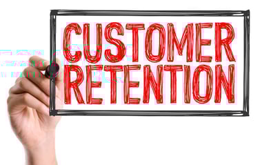 Hand with marker writing the text Customer Retention.jpeg